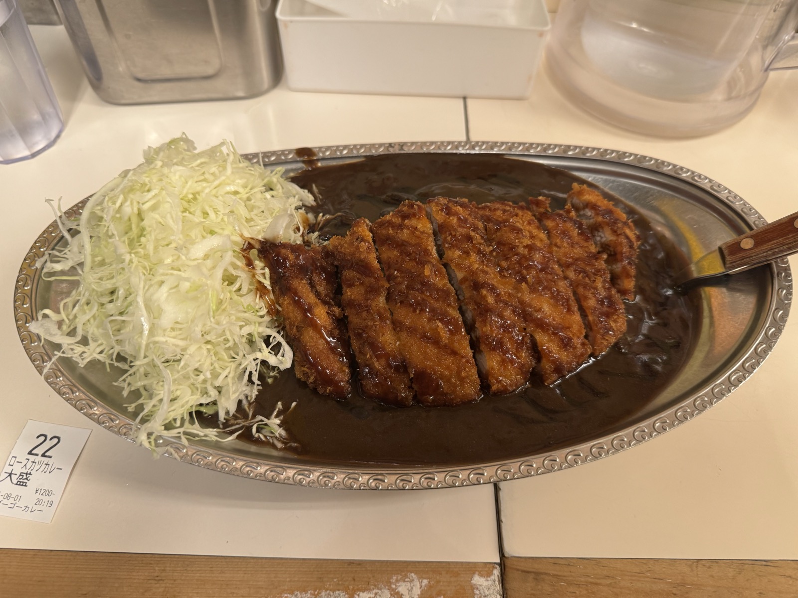 Rosu katsu curry, large size, on a stainless plate with shredded cabbage